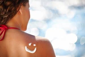 stock image of a woman on a beach for blog about cosmetic treatments to refresh the skin after the summer in NY,NY