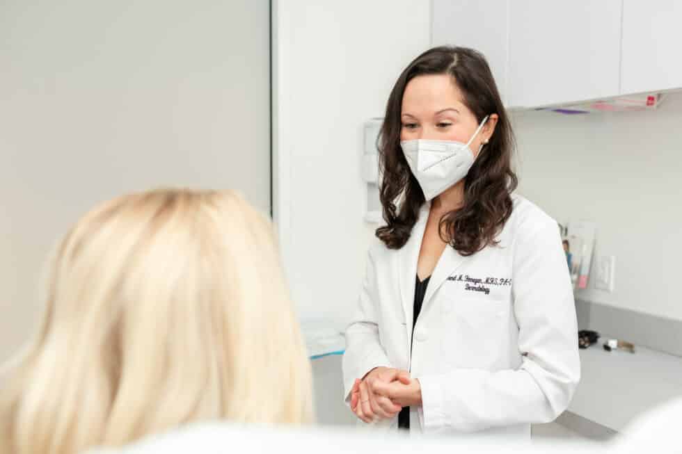 patient consulting with a dermatologist in NYC about how to limit the risk of skin cancer