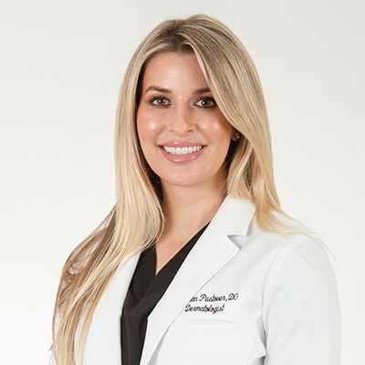 Headshot of Kaylan Pustover Board Certified Dermatologist from Spring Street Dermatology New York City, NY.