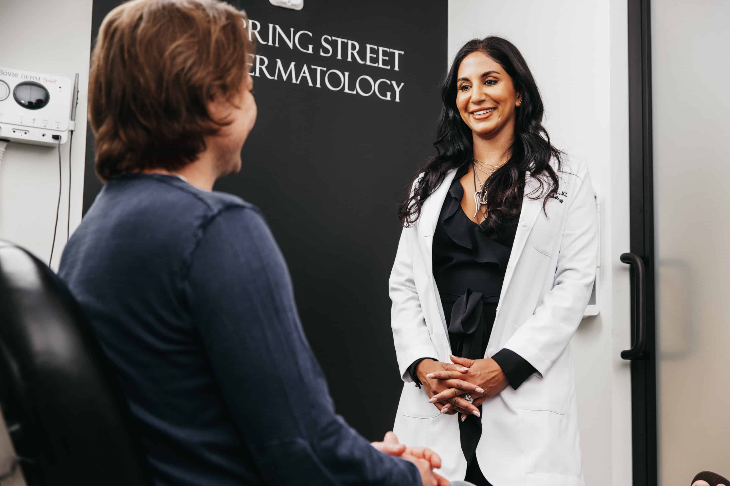Image showing dermatologist giving a consultation to her patient, a young woman at Spring Street Dermatology, New York City, NY